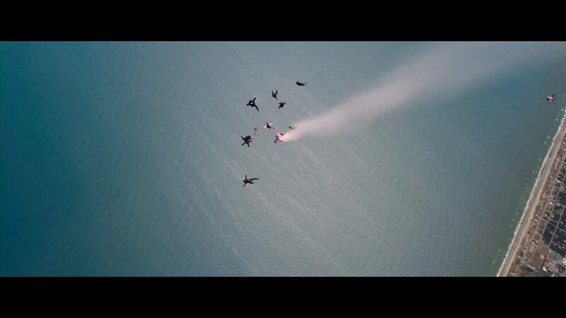Skydivers over the ocean