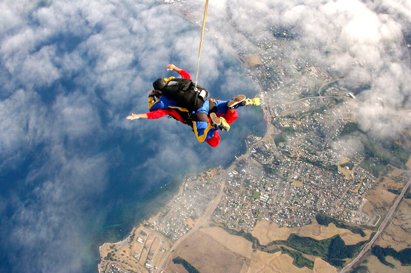 Skydiving over coastal town