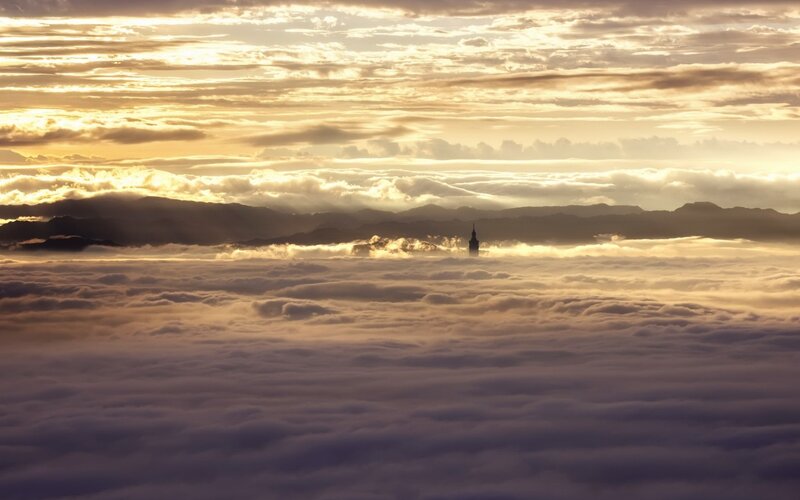 Skyscraper Above Clouds