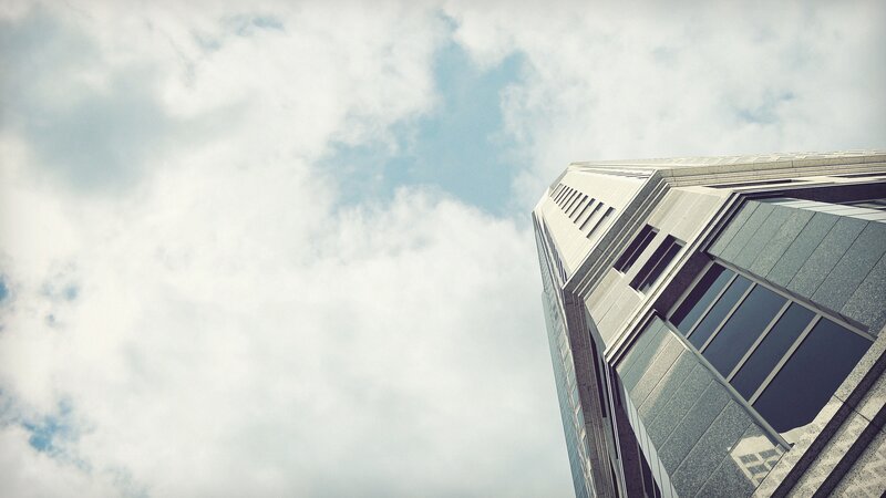 skyscraper against cloudy sky