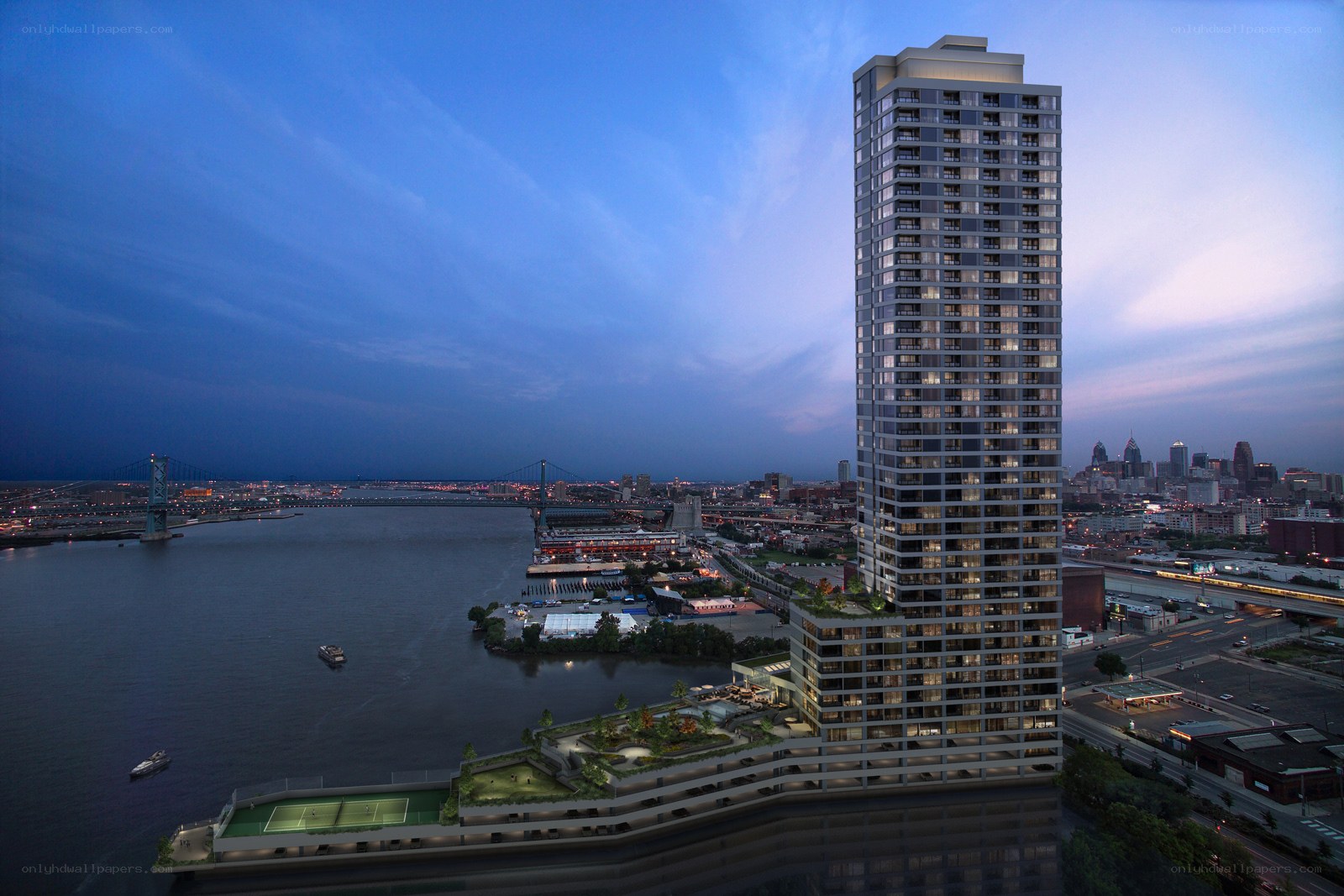 Skyscraper by the river at dusk