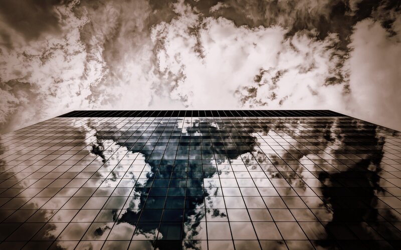Skyscraper Reflecting Clouds — Gray