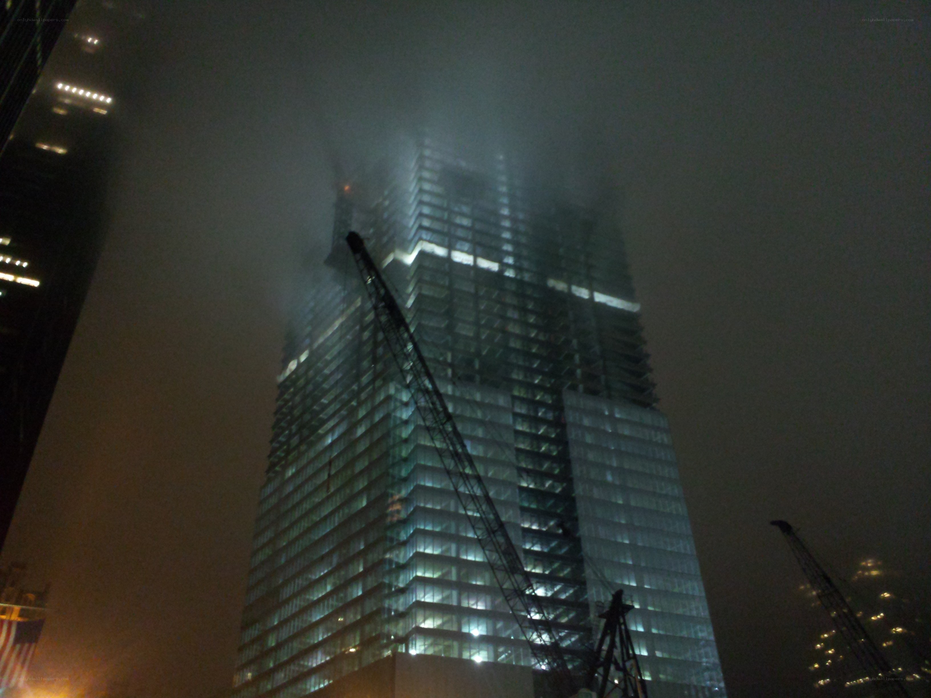 Skyscraper under construction at night