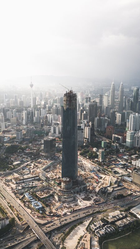Skyscraper under Construction — Gray, Hazy