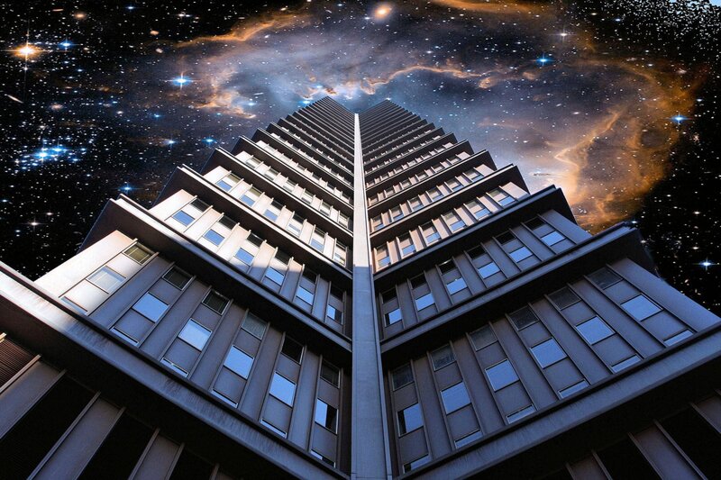 skyscraper under starry sky