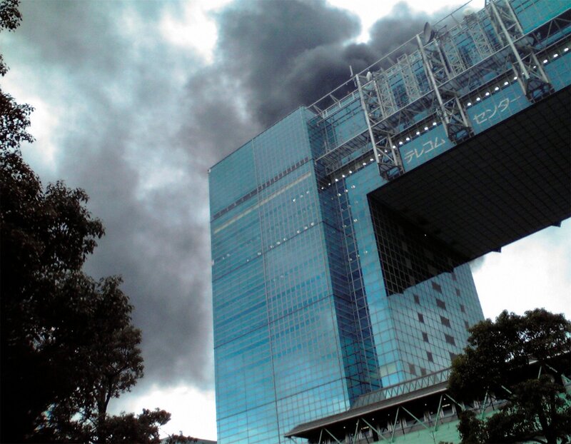 Skyscraper with Black Smoke