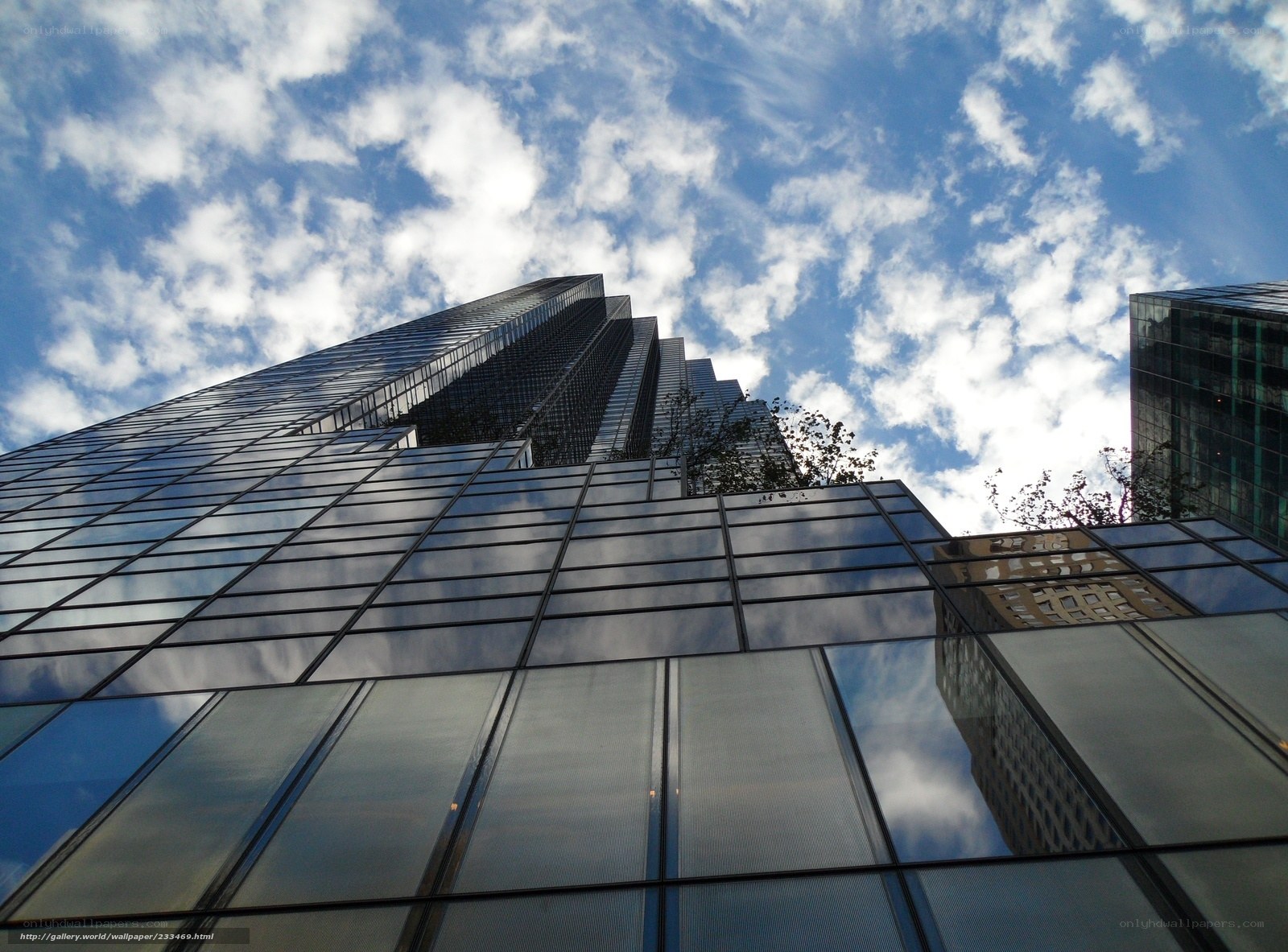 skyscraper with cloudy sky