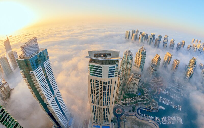 Skyscrapers Above Clouds — Blue, Serene, Sunrise