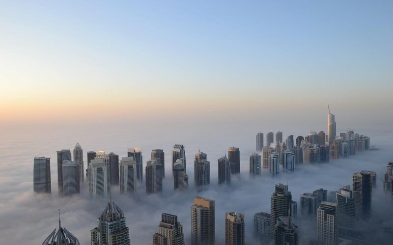 Skyscrapers Above Clouds — Blue