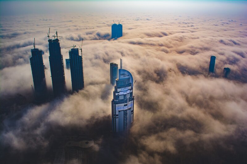 Skyscrapers Above Clouds — Gray, Dramatic