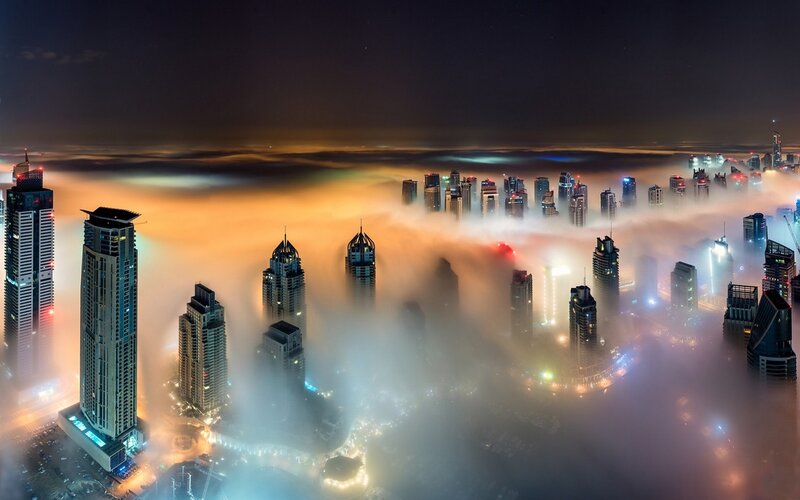 Skyscrapers Above Clouds — Orange, Dramatic, Night