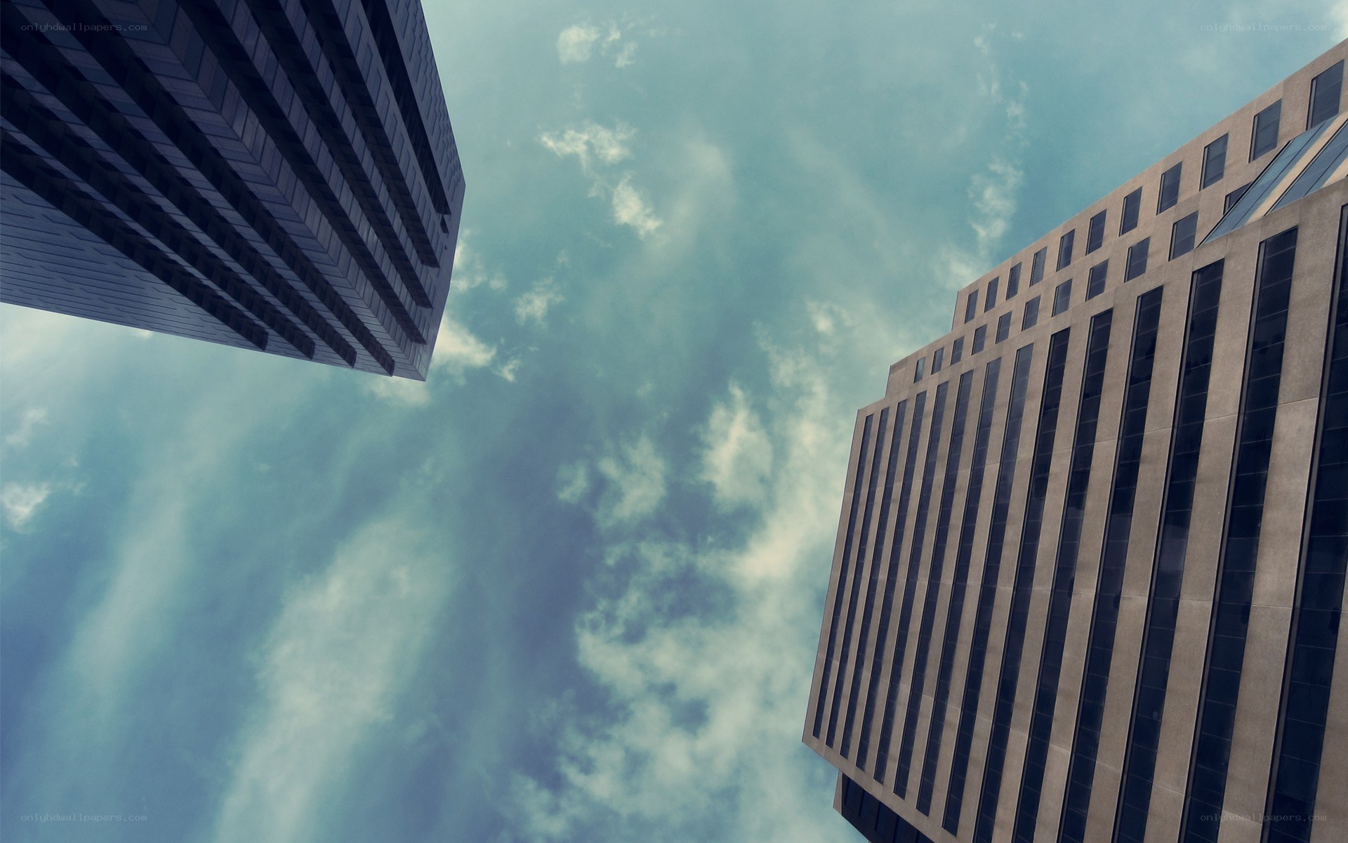 skyscrapers against cloudy sky