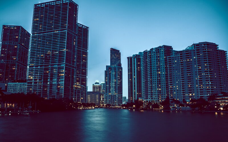 Skyscrapers Along Waterfront — Blue