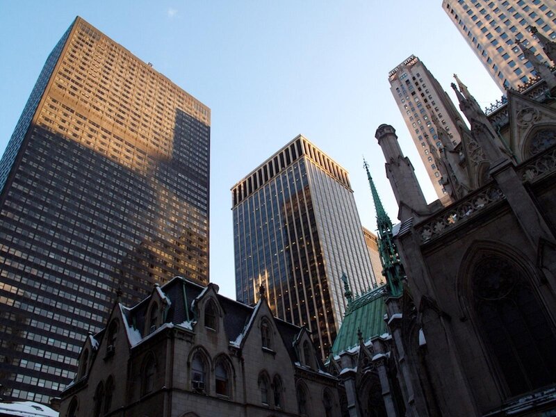skyscrapers and cathedral in city