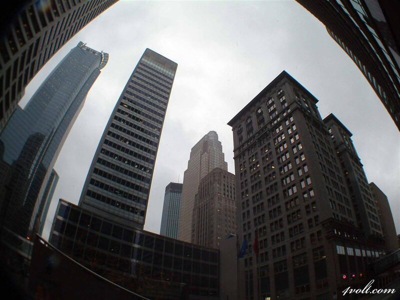 Skyscrapers in City — Gray, Dramatic, Afternoon, Photograph, Buildings, Sky, Flags