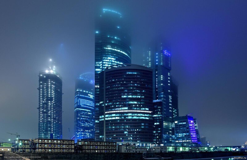 Skyscrapers in fog at night