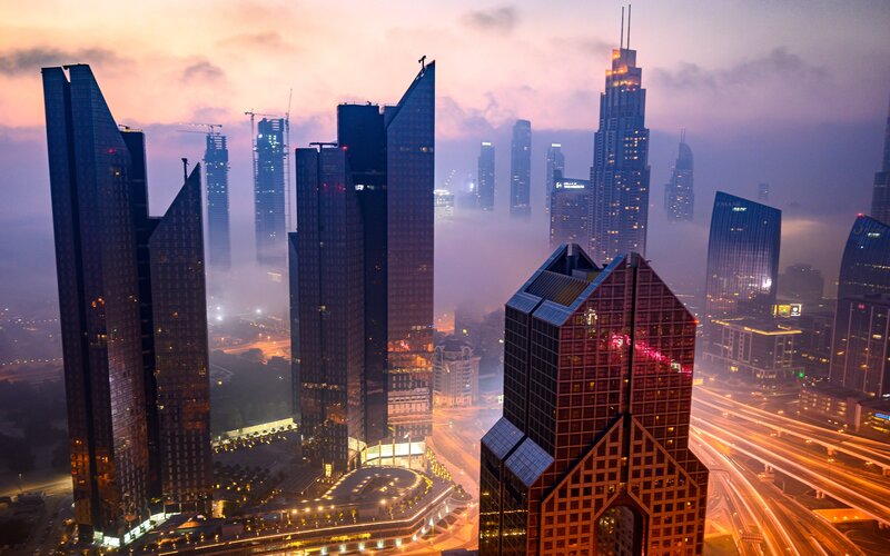 Skyscrapers in Fog — Purple, Dramatic, Sunset