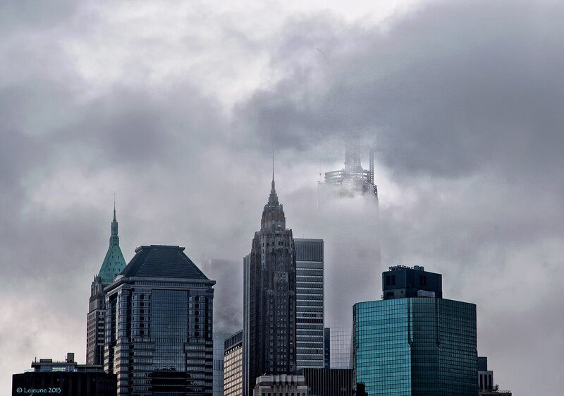 Skyscrapers in foggy city