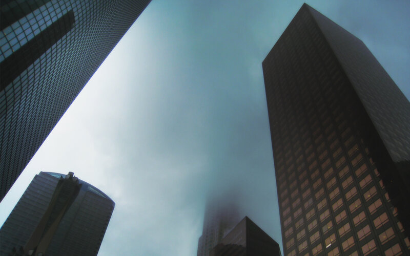 skyscrapers in foggy city