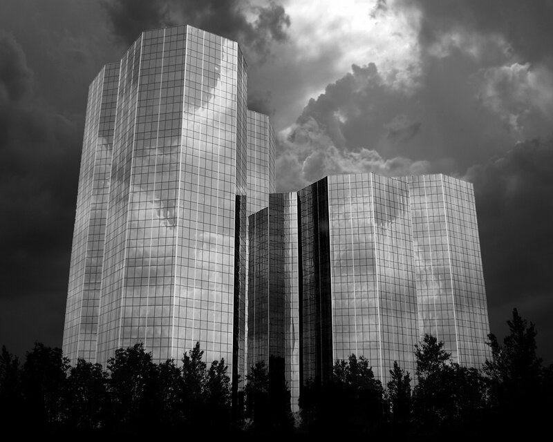 Skyscrapers reflecting storm clouds