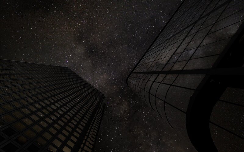 skyscrapers under starry sky