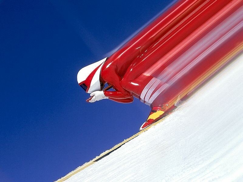 sledder in red suit