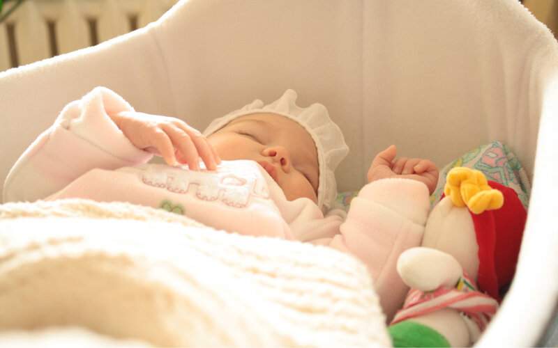Sleeping Baby in Bassinet