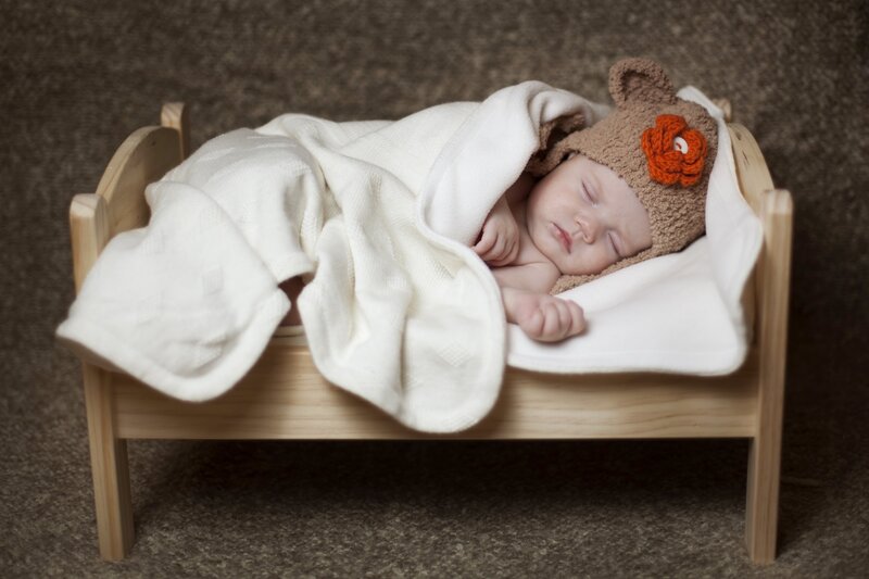 Sleeping Baby in Bed — Brown