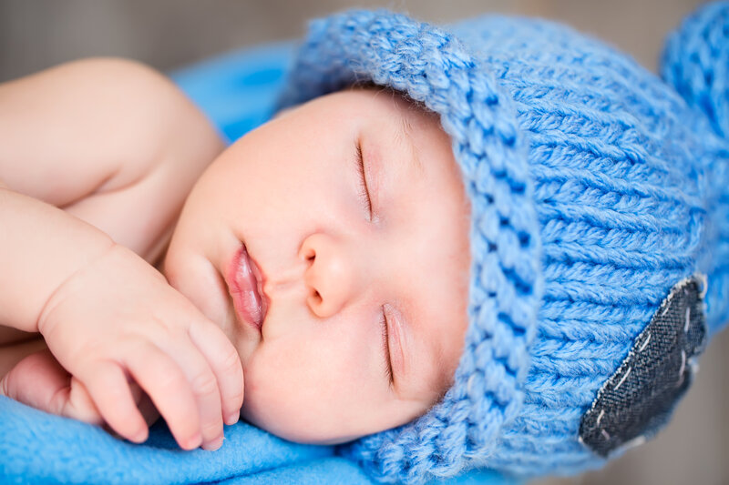 Sleeping Baby in Blue Hat — Serene