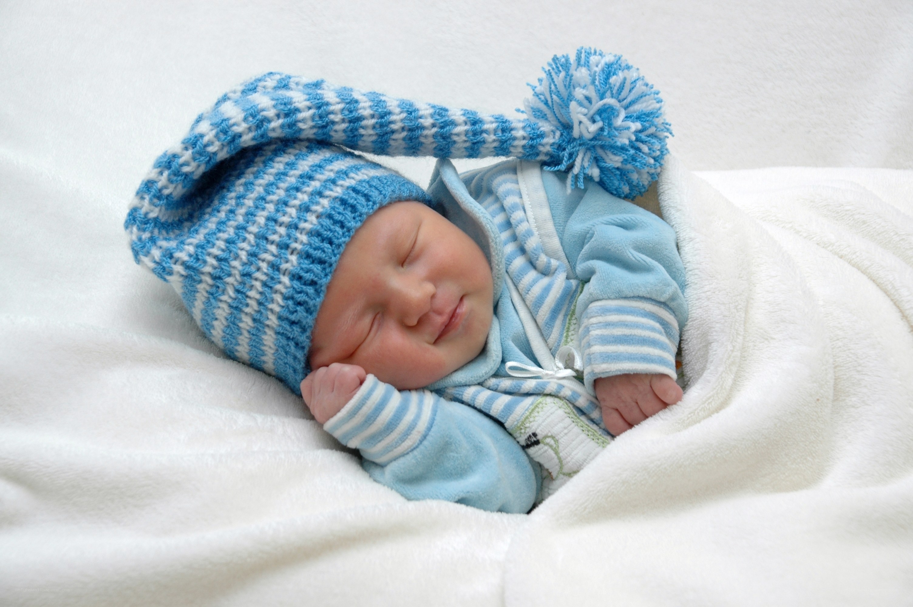 Sleeping baby in blue hat