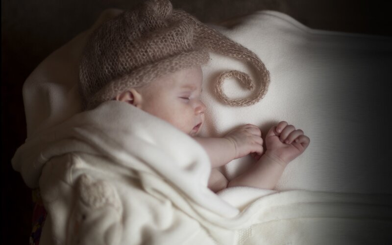 Sleeping Baby in Hat — White, Serene