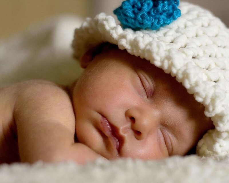 sleeping baby in knitted hat