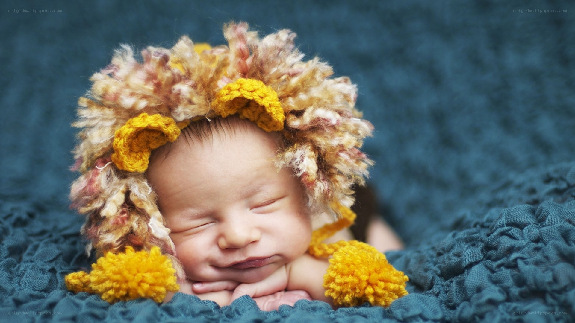 Sleeping baby in lion hat
