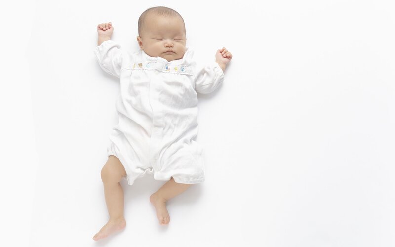 Sleeping Baby in Onesie — White