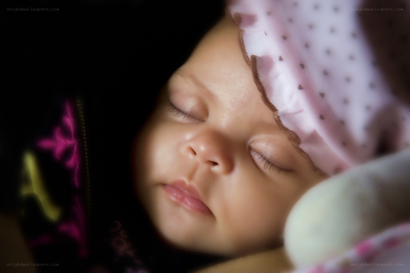 sleeping baby in pink hat