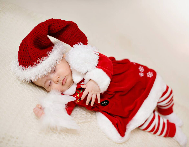 Sleeping Baby in Santa Outfit