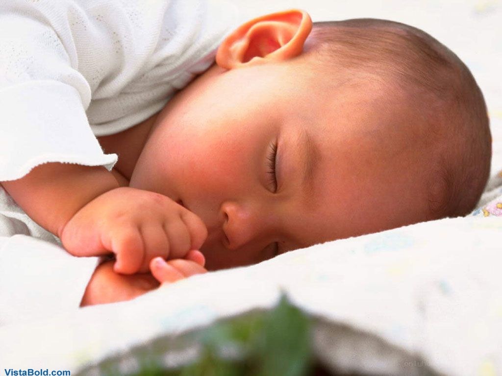 sleeping baby on blanket