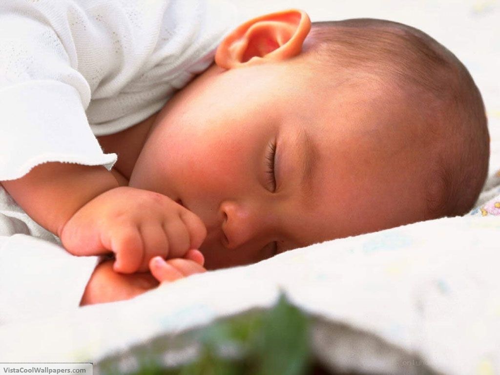 sleeping baby on blanket