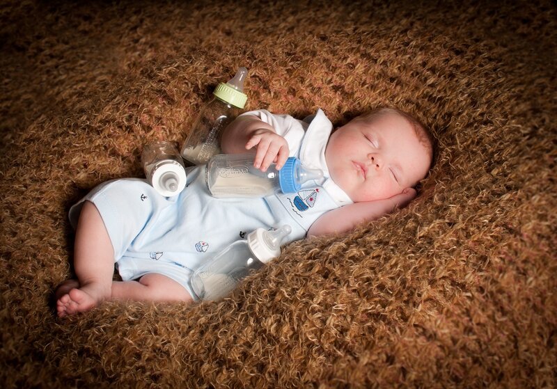 Sleeping Baby with Bottles
