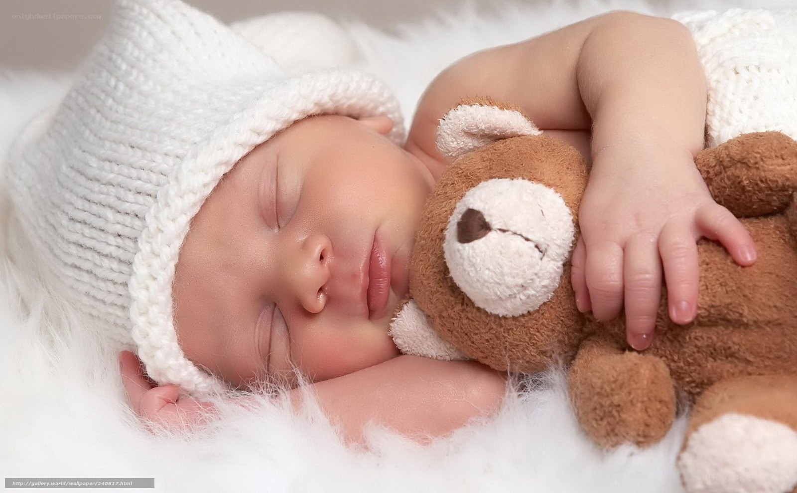 Sleeping baby with teddy bear