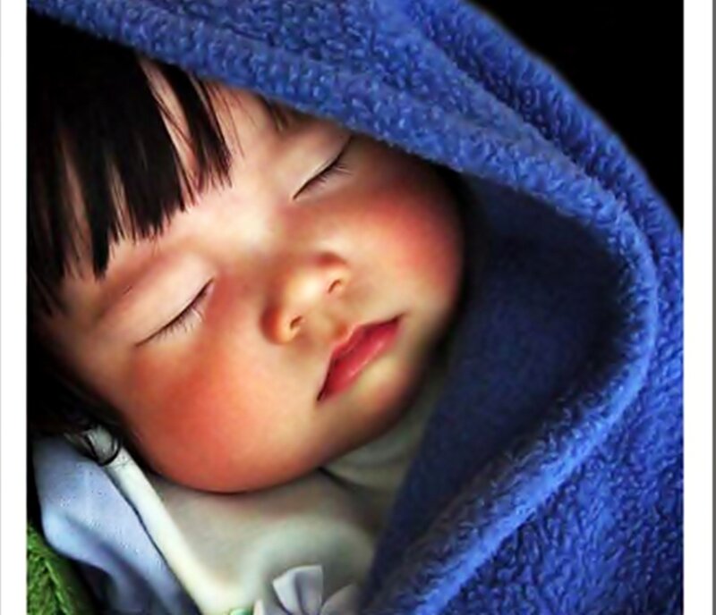 Sleeping Baby Wrapped in Blanket