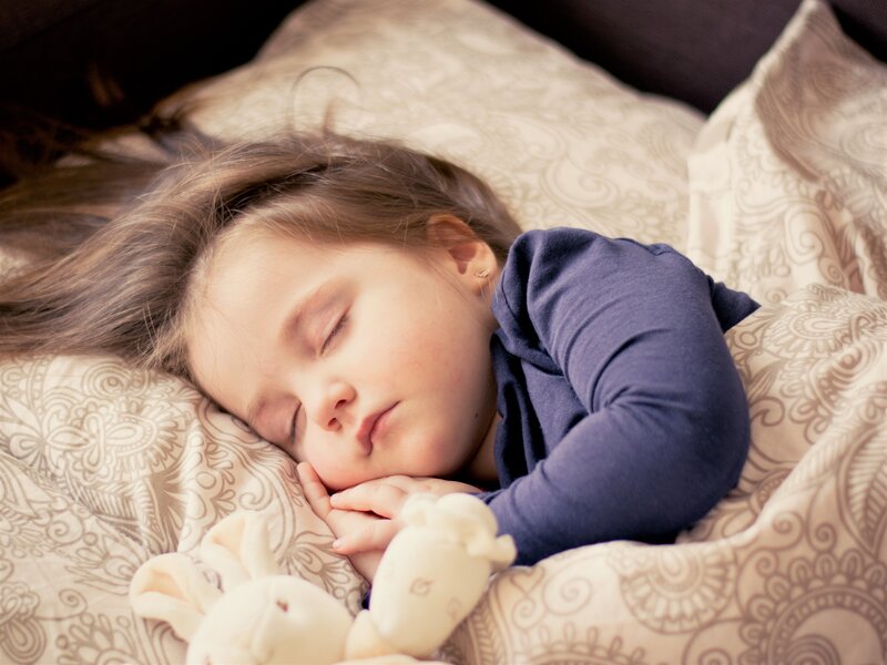 Sleeping Child on Pillow — Beige