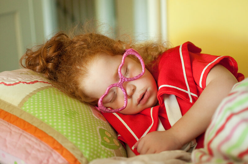 Sleeping Child with Glasses