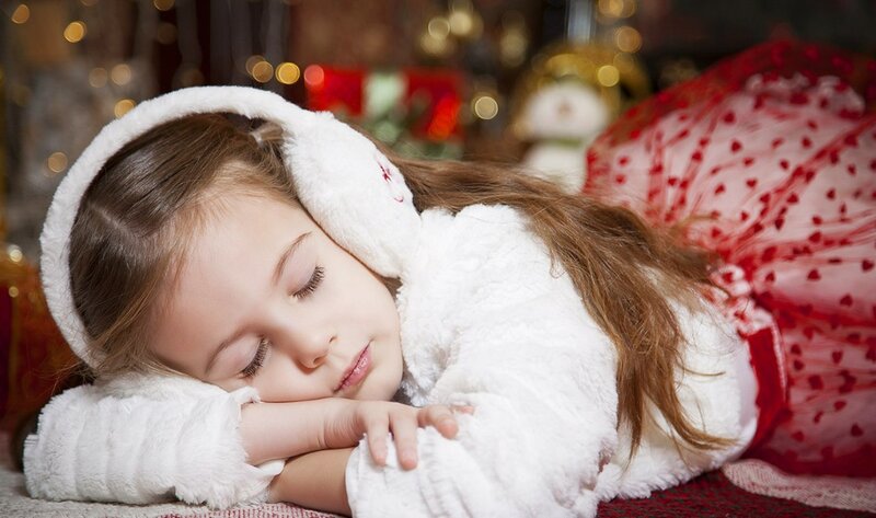 Sleeping Girl in Winter Clothes