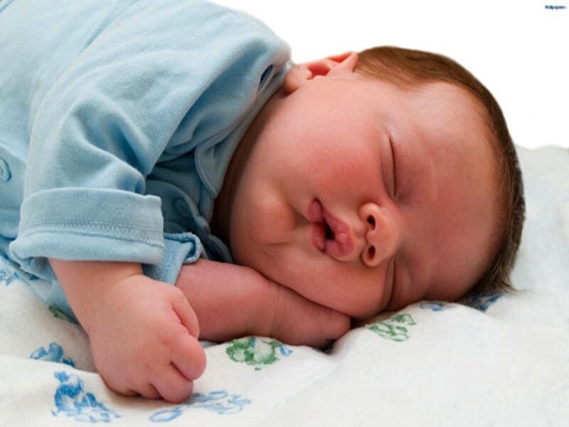 Sleeping Newborn Baby — White, Peaceful, Photograph, Blanket, Blue Onesie