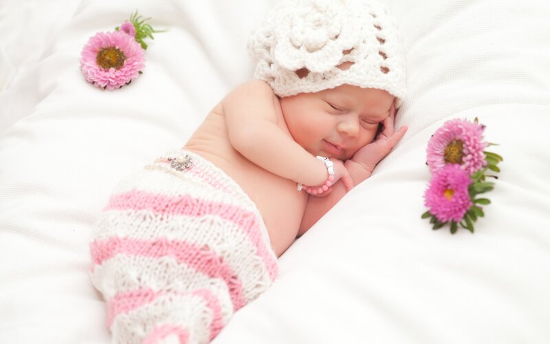 Sleeping Newborn Baby — White, Serene, Photograph, Knitted Hat, Flowers