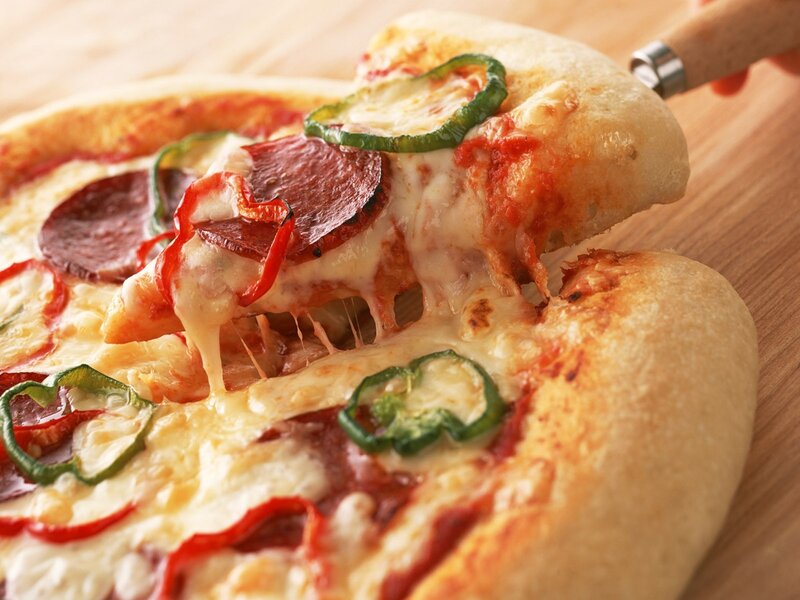 Slice of pepperoni and jalapeno pizza