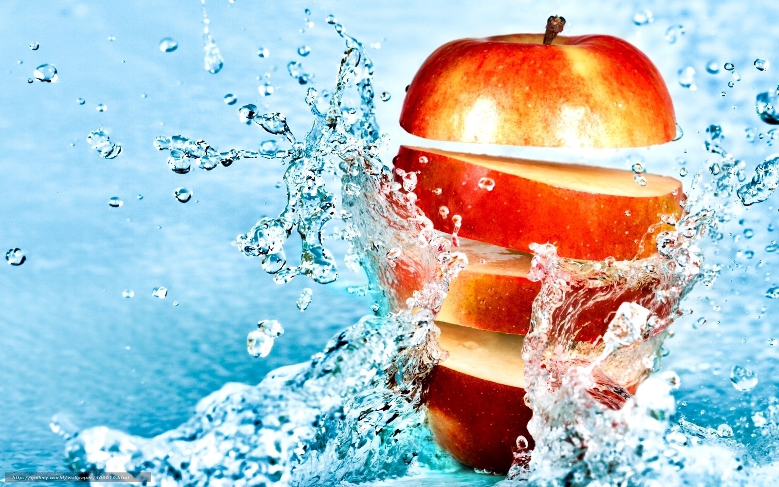 sliced apple in water splash
