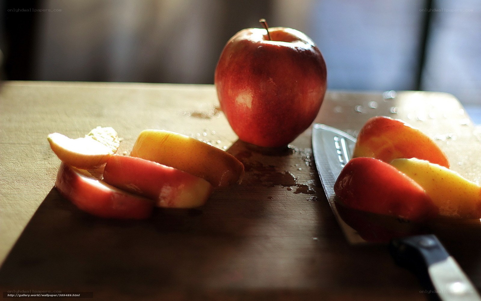 sliced apple on cutting board