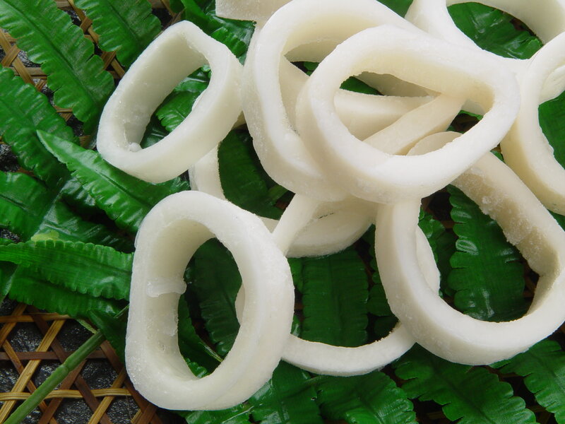 Sliced calamari on green leaves